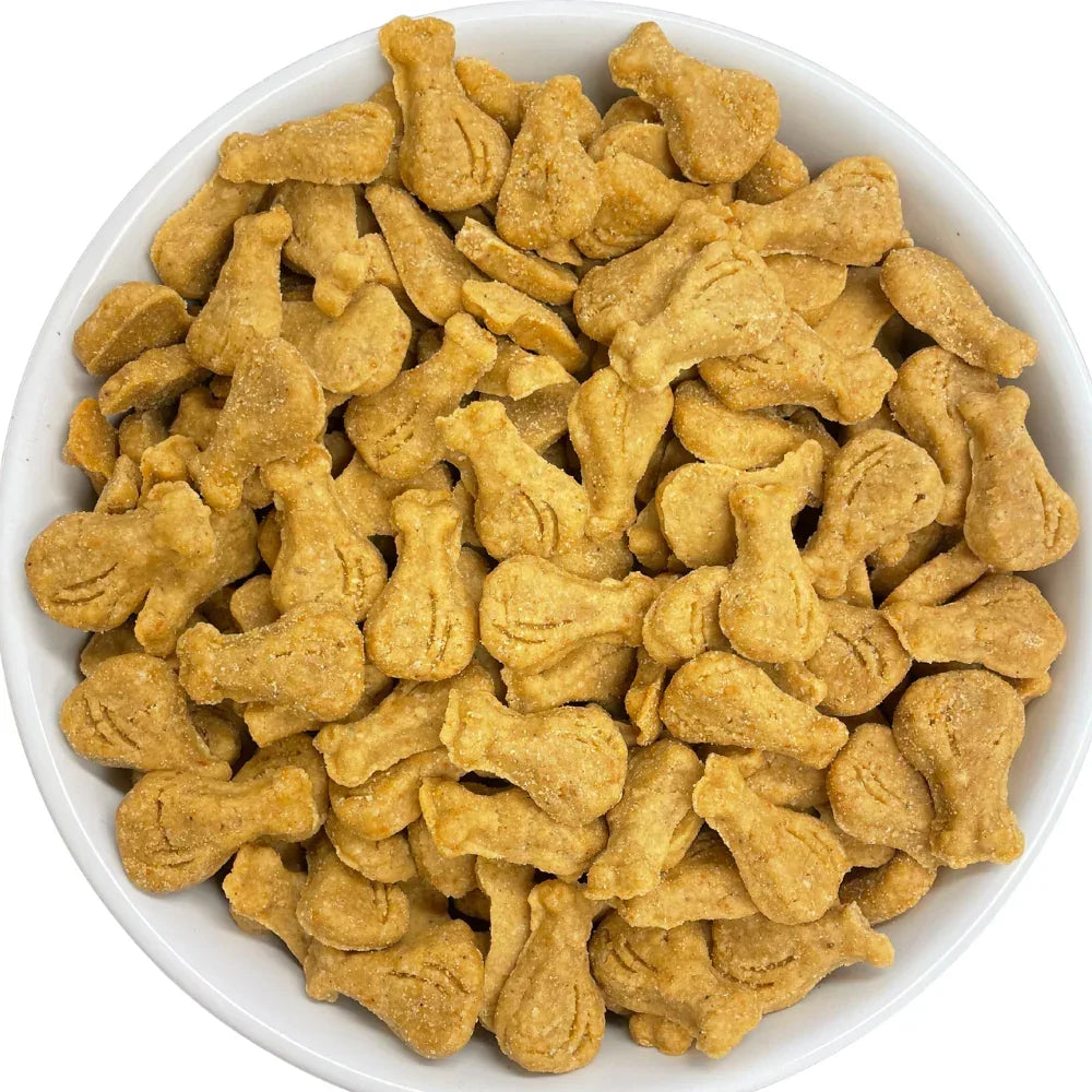 Bowl of all-natural dog treats shaped like drumsticks