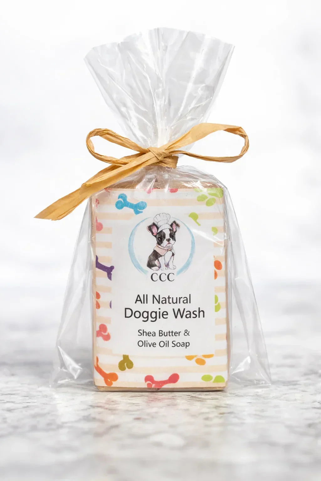 All natural doggie wash soap bar with shea butter and olive oil in clear gift packaging
